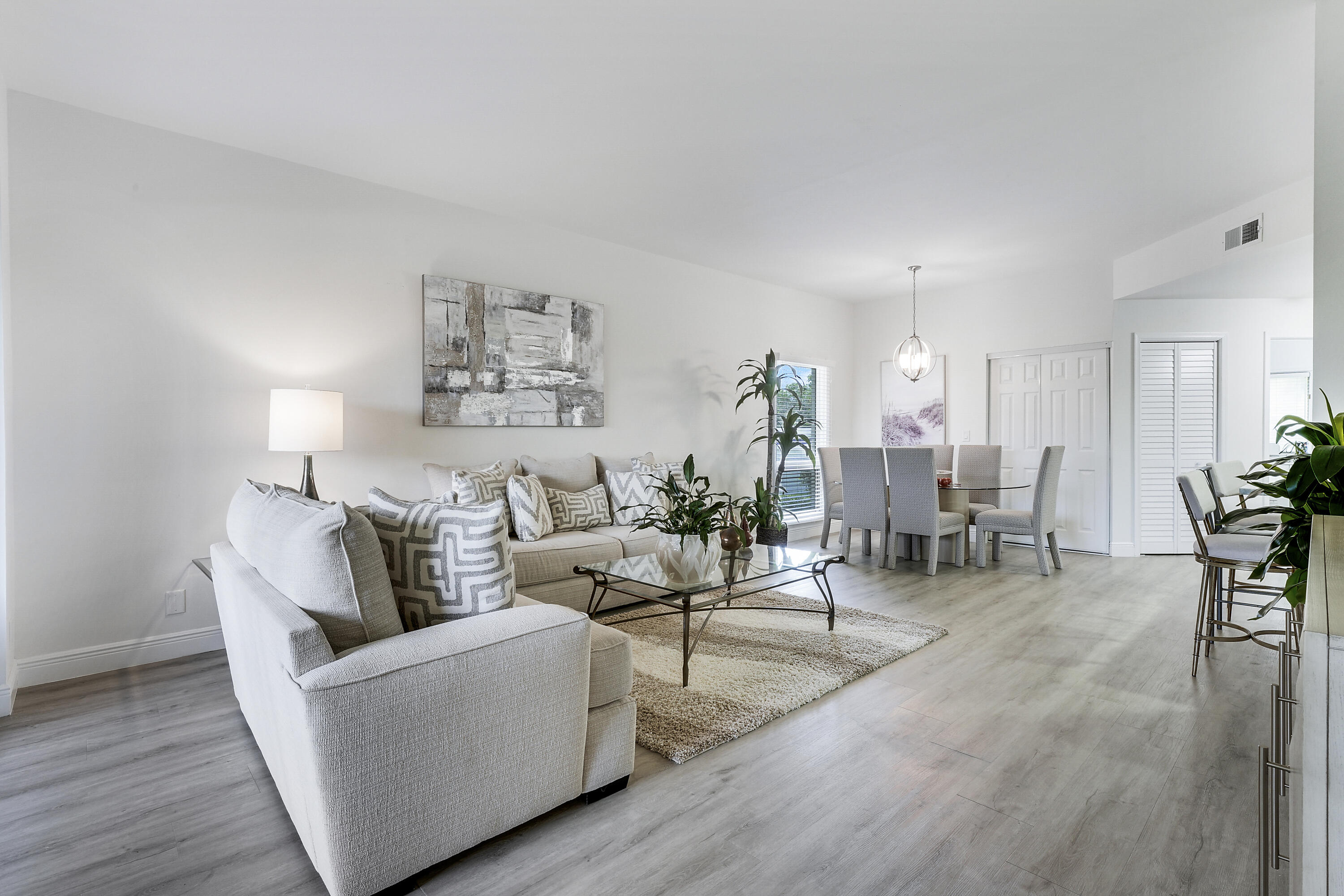 7860 Seville Place, Unit 2203 Boca Raton, FL 33433 - Photo 10 of 43 a living room with furniture and wooden floor