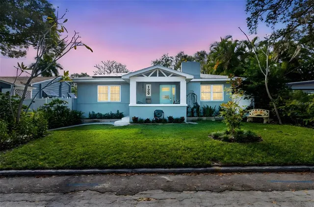 a front view of a house with garden