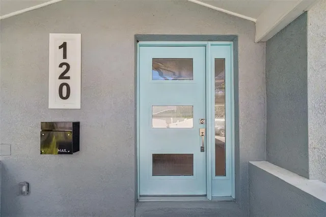 a kitchen with a sink a counter top space appliances and cabinets