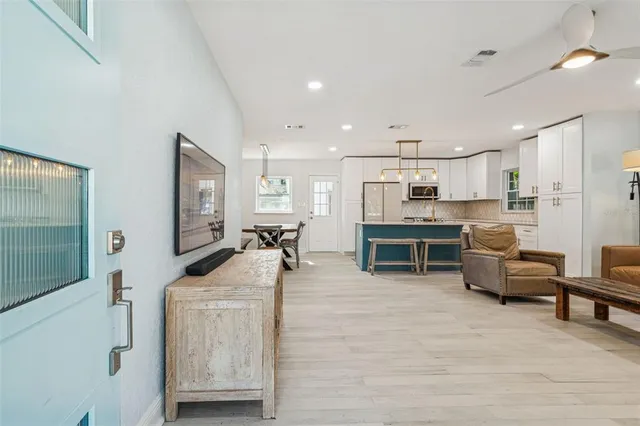 a view of a dining room with furniture and wooden floor