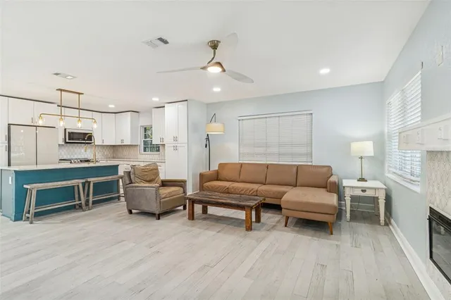 a living room with a fireplace and a table