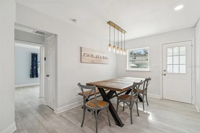 a bathroom with a shower a mirror and a sink