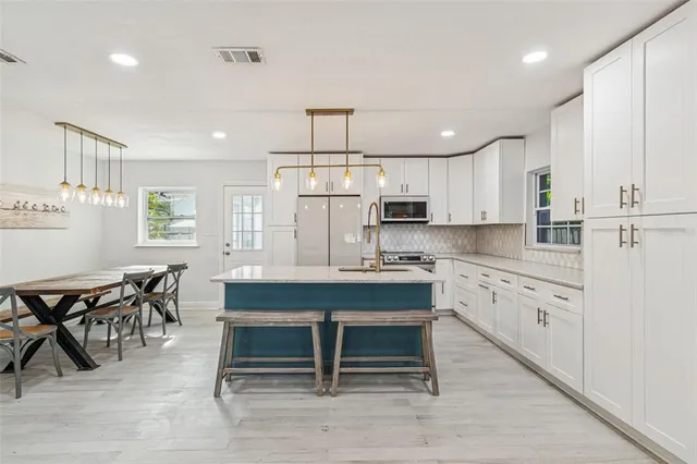 a backyard of a house with outdoor seating