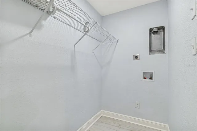 a front view of a house with yard and tree s