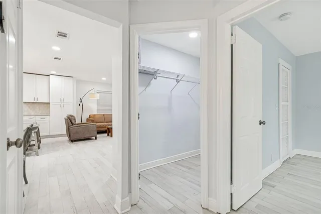 a view of a house with backyard sitting area and garden