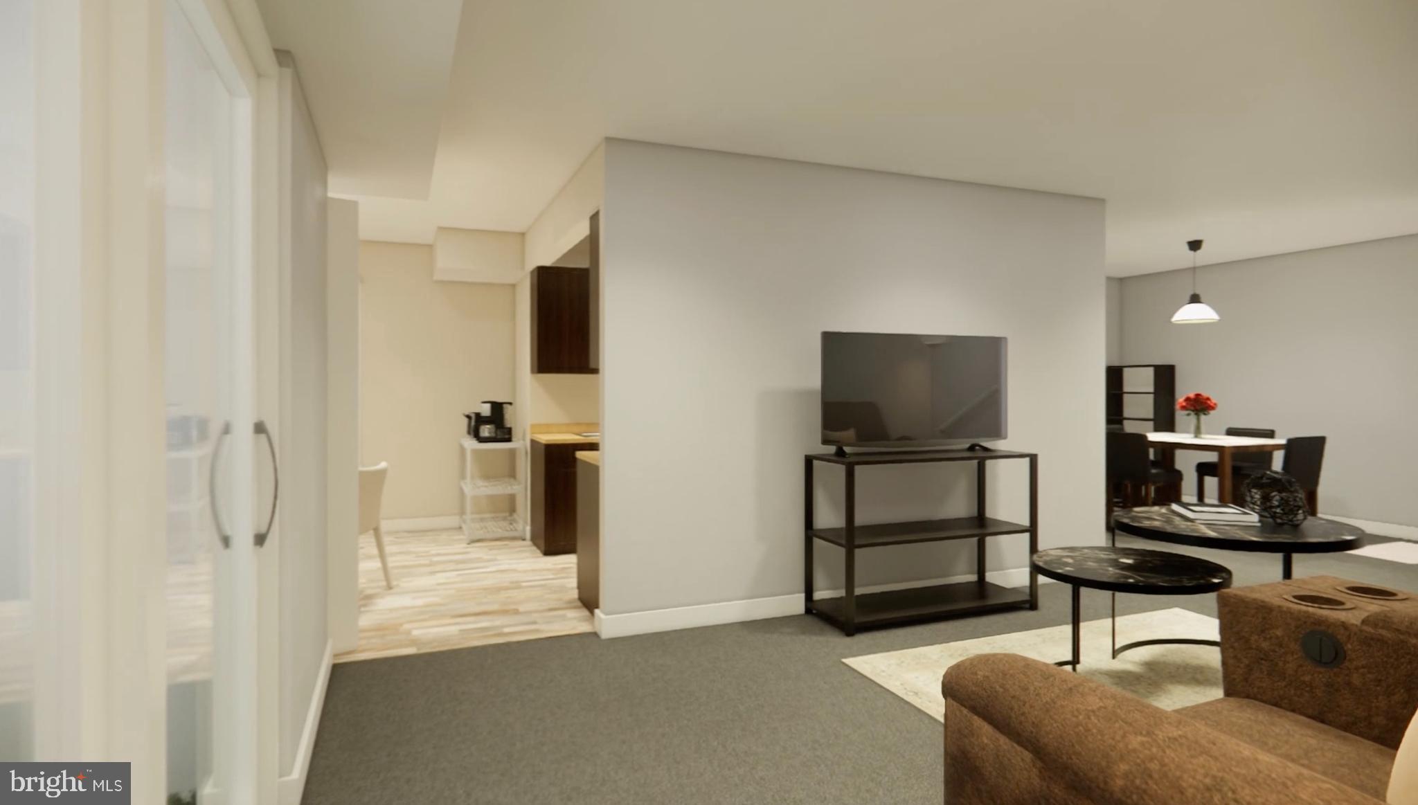 8007 Mandan Road, Unit 203 Greenbelt, MD 20770 - Photo 14 of 25 a living room with furniture and a flat screen tv