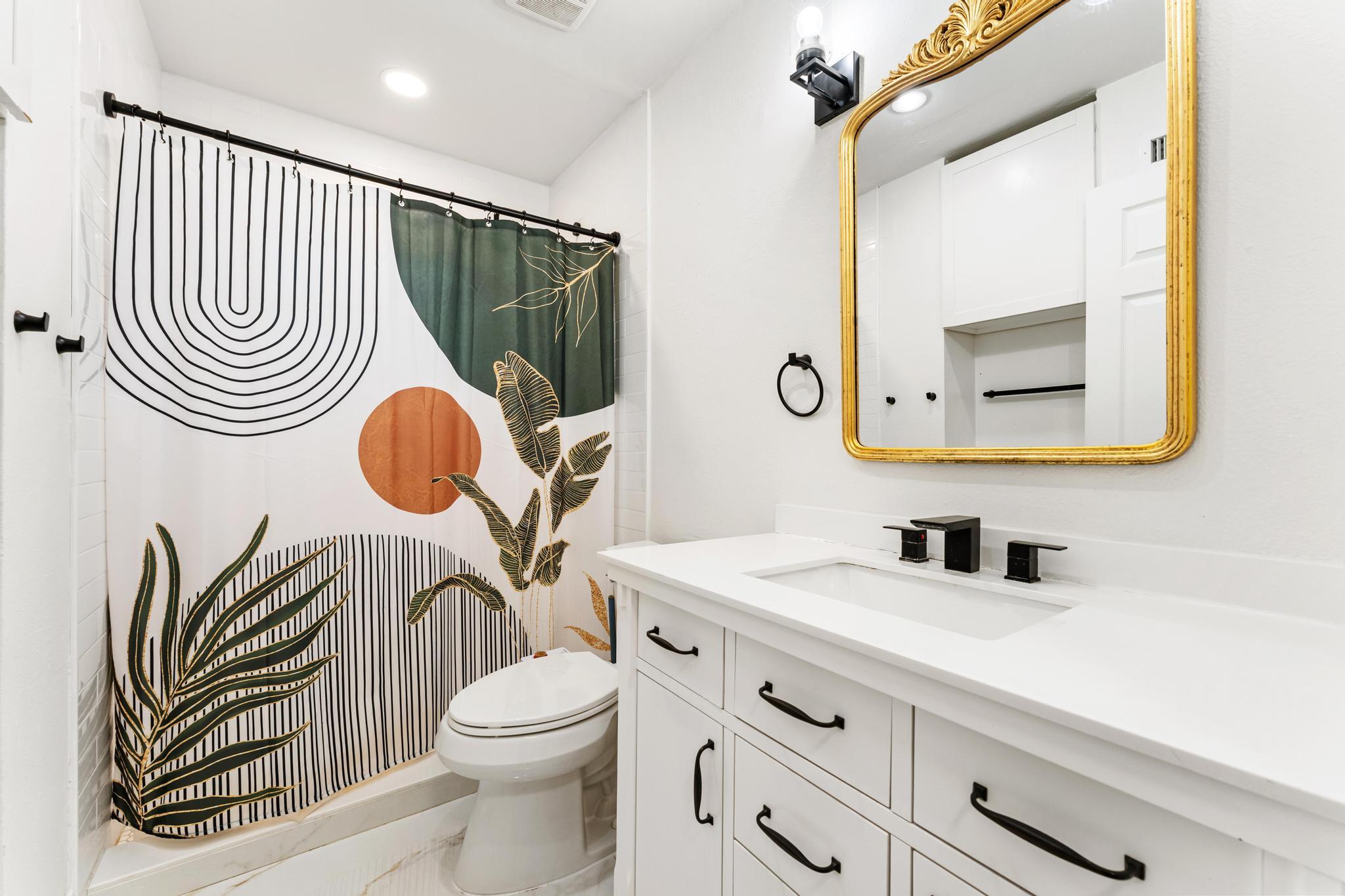 3179 Melaleuca Road West Palm Beach, FL 33406 - Photo 11 of 49 a bathroom with a sink a mirror a toilet and a mirror