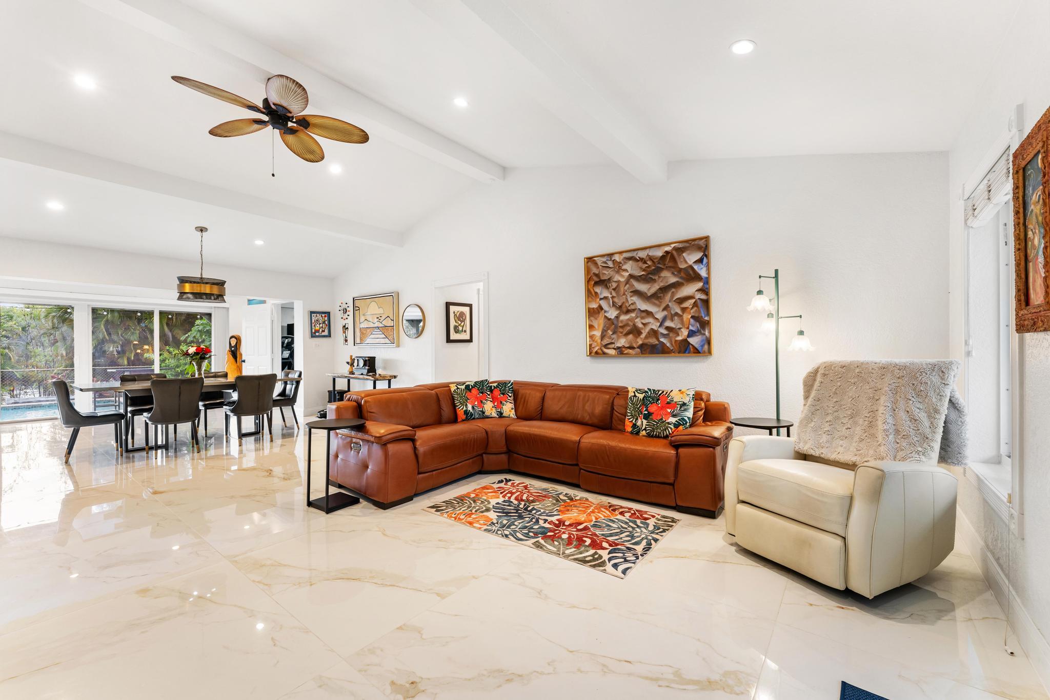 3179 Melaleuca Road West Palm Beach, FL 33406 - Photo 2 of 49 a living room with furniture and kitchen view