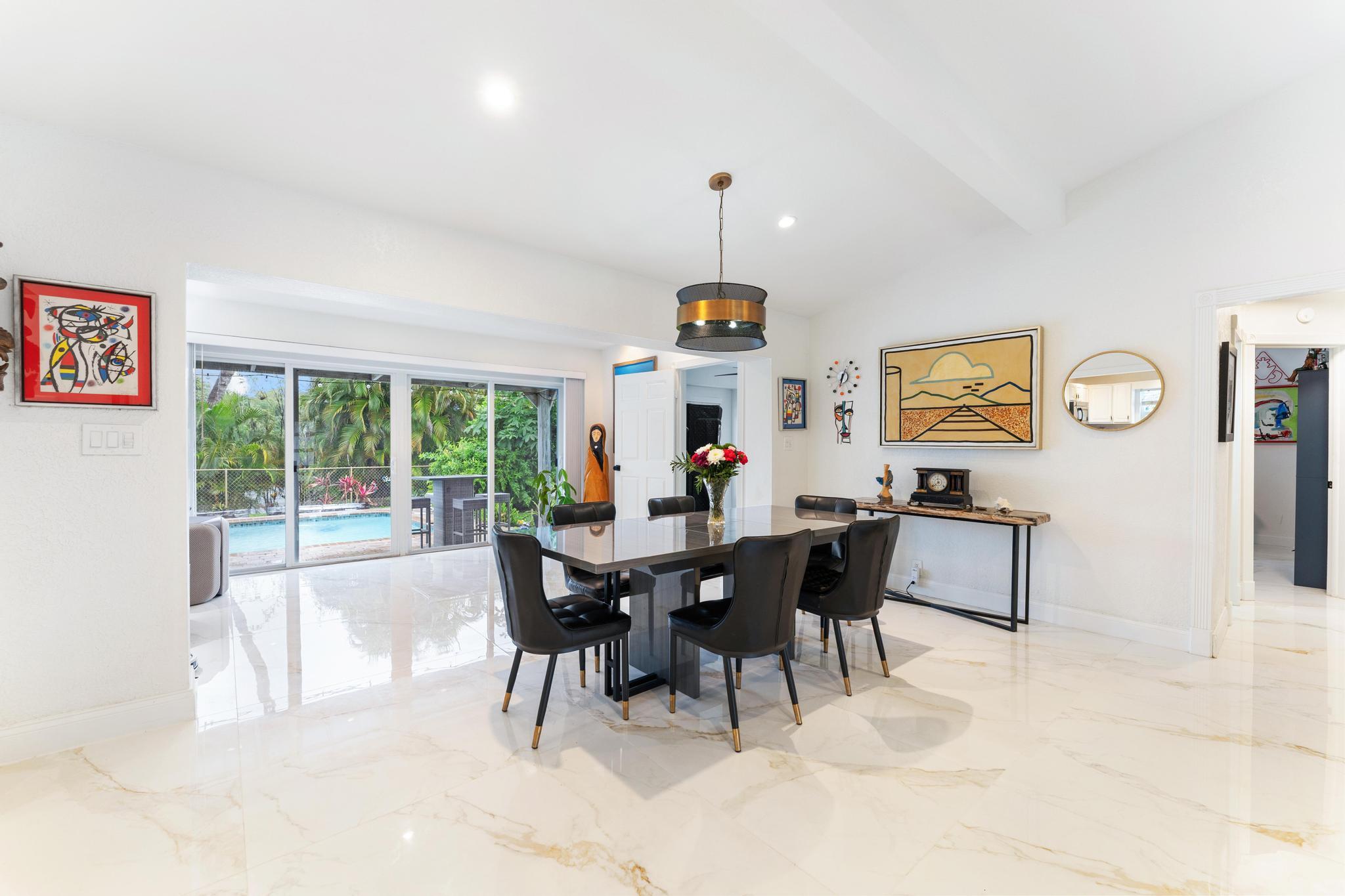 3179 Melaleuca Road West Palm Beach, FL 33406 - Photo 21 of 49 a view of a dining room with furniture window and outside view