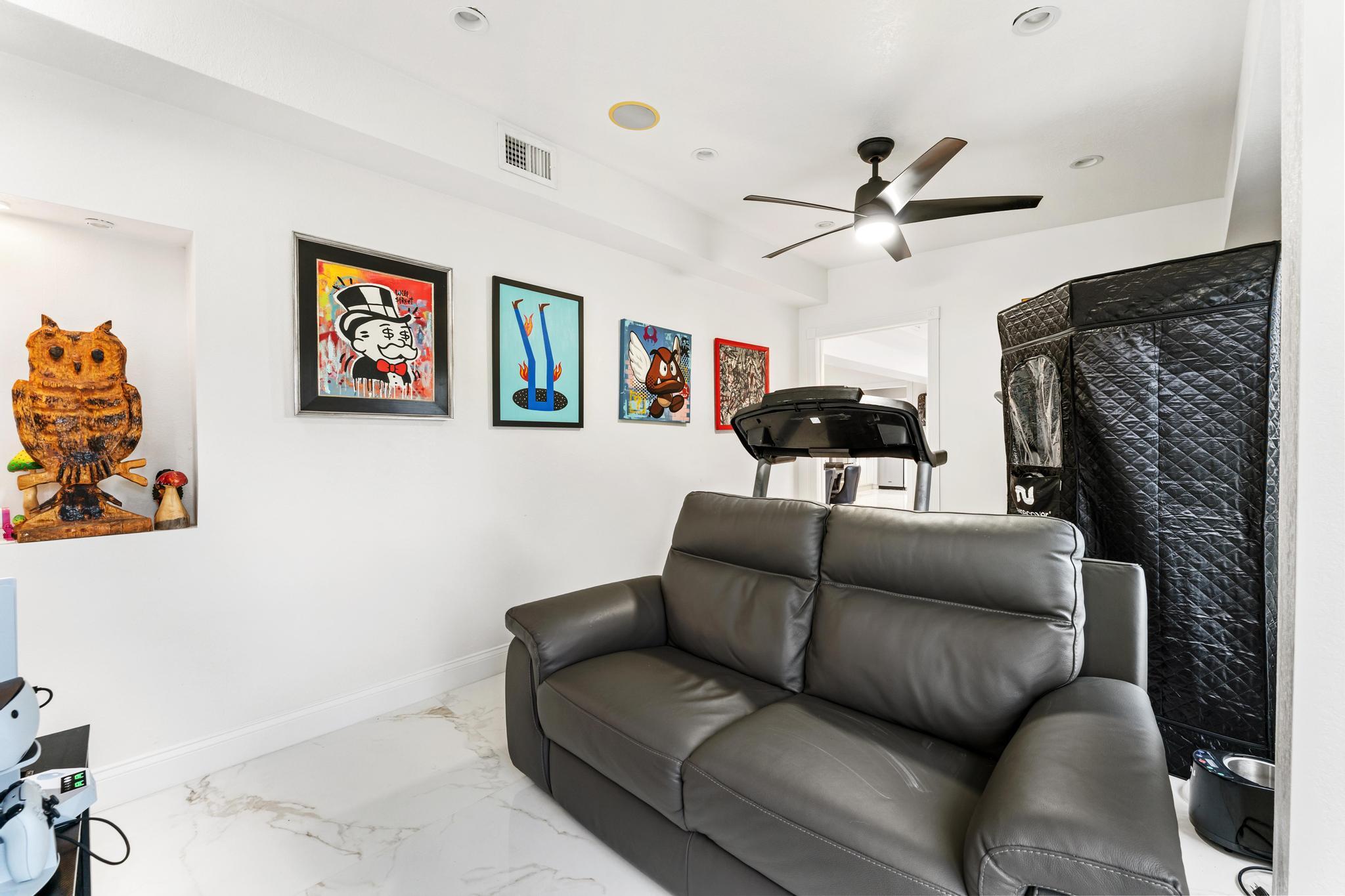 3179 Melaleuca Road West Palm Beach, FL 33406 - Photo 23 of 49 a living room with furniture and a ceiling fan