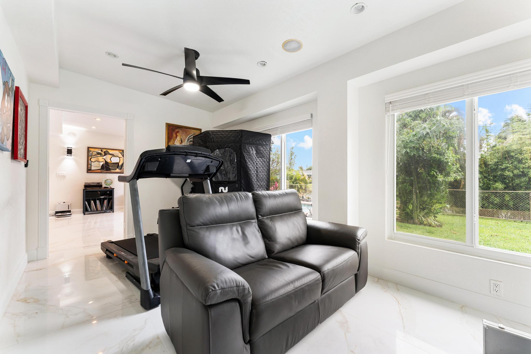 3179 Melaleuca Road West Palm Beach, FL 33406 - Photo 24 of 49 a living room with furniture and a large window