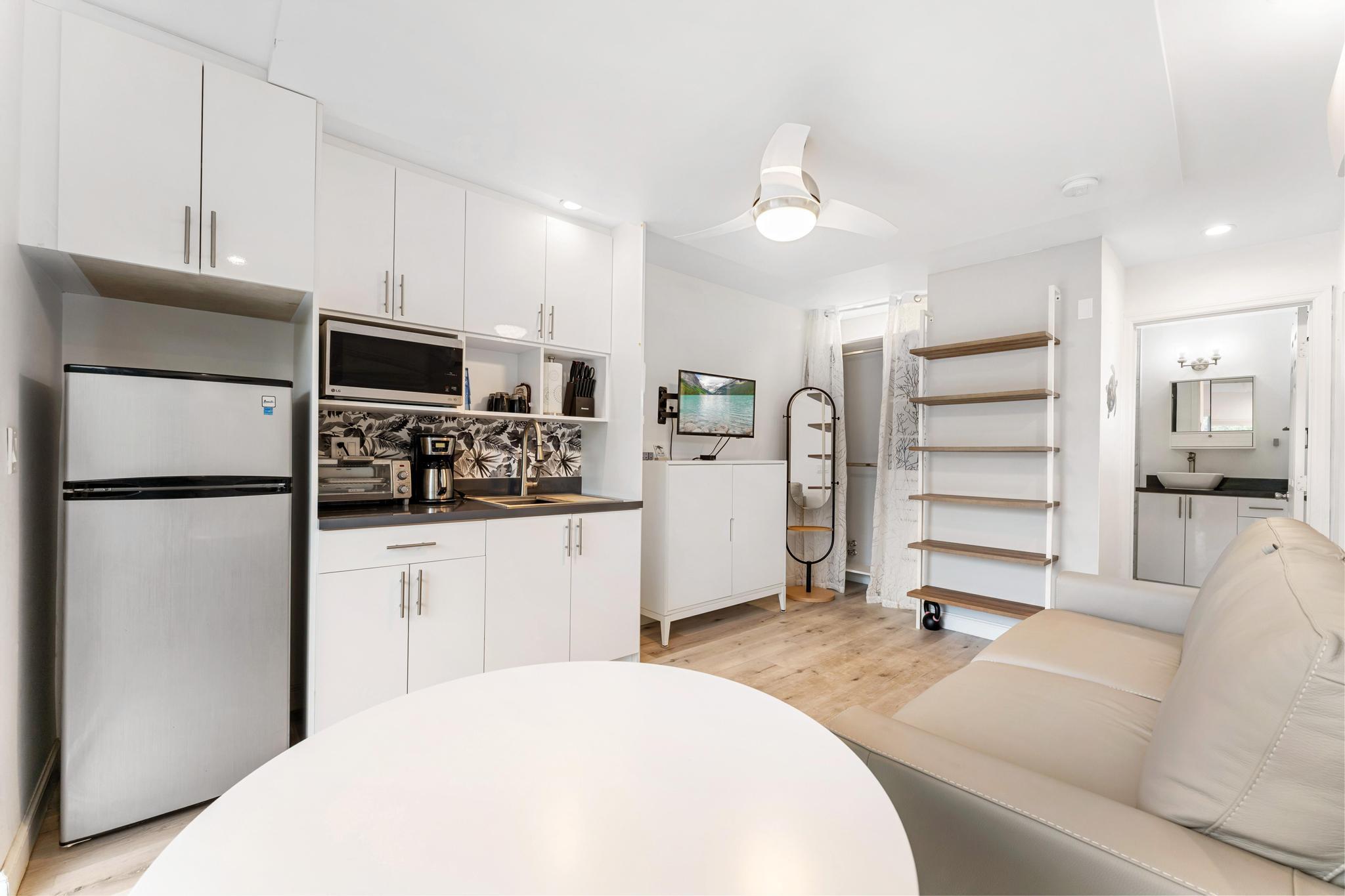 3179 Melaleuca Road West Palm Beach, FL 33406 - Photo 33 of 49 a kitchen with a refrigerator and a sink