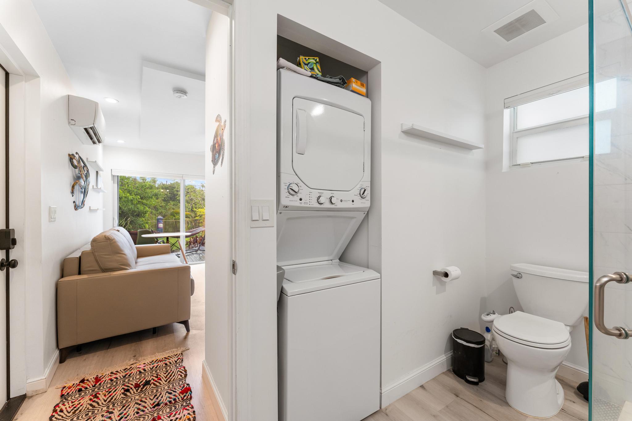 3179 Melaleuca Road West Palm Beach, FL 33406 - Photo 36 of 49 a bathroom with a toilet a sink and a mirror