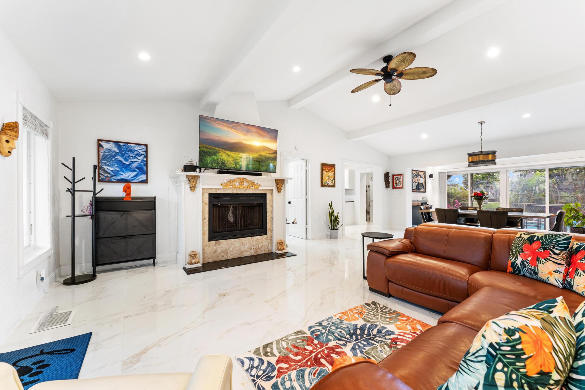 3179 Melaleuca Road West Palm Beach, FL 33406 - Photo 4 of 49 a living room with furniture and a flat screen tv