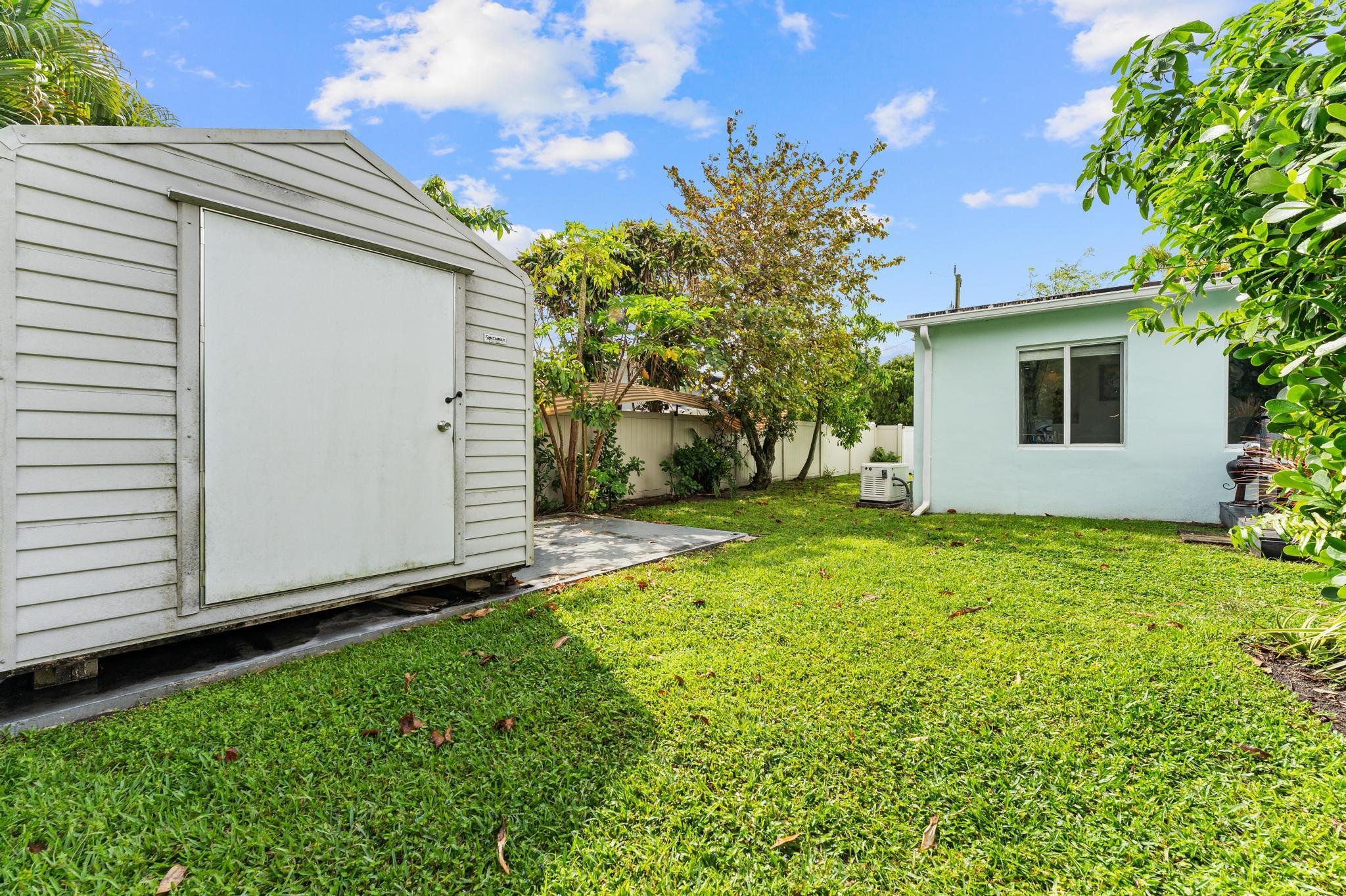 3179 Melaleuca Road West Palm Beach, FL 33406 - Photo 45 of 49 a view of backyard of house with green space