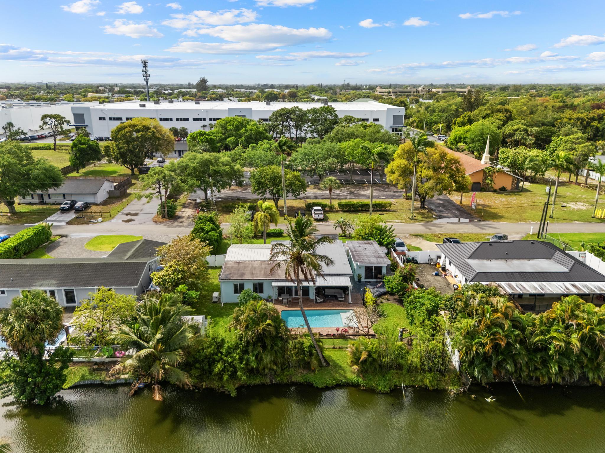 3179 Melaleuca Road West Palm Beach, FL 33406 - Photo 47 of 49 an aerial view of residential houses with outdoor space and lake view