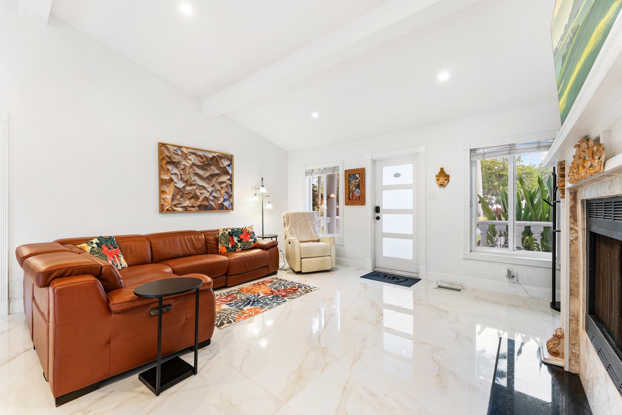 3179 Melaleuca Road West Palm Beach, FL 33406 - Photo 5 of 49 a living room with furniture and a flat screen tv