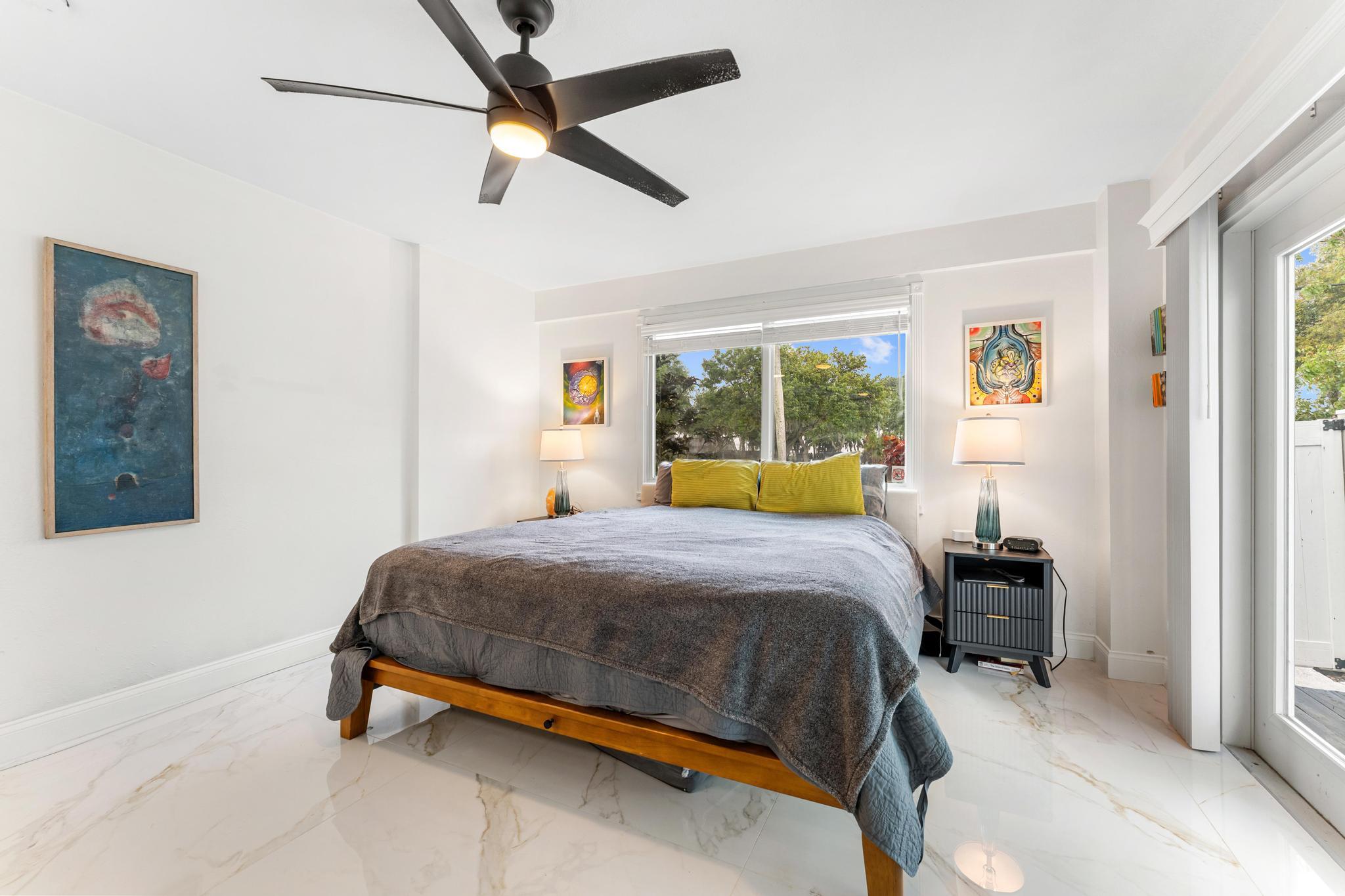 3179 Melaleuca Road West Palm Beach, FL 33406 - Photo 10 of 49 a bedroom with a bed and a window