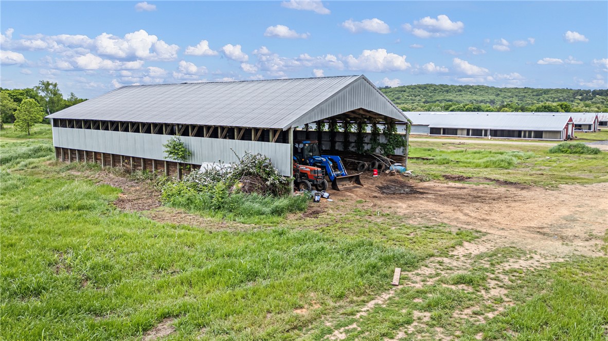 0 Wire Road Mulberry, AR 72947 - Photo 14 of 31 Large open-air barn with a metal roof and slatted sides