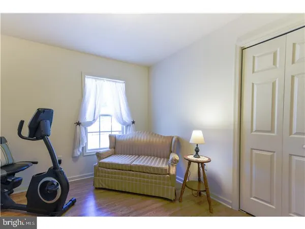 a living room with furniture a table and chair