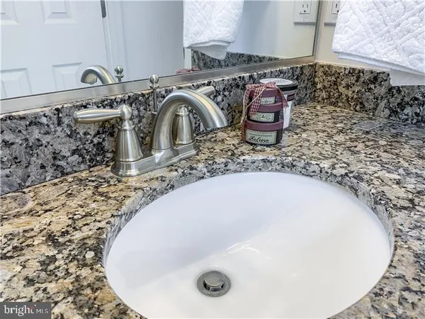 a bathroom with a shower and a sink
