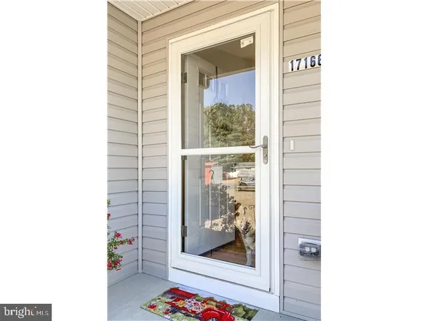 a picture of a bathroom with a shower and a mirror