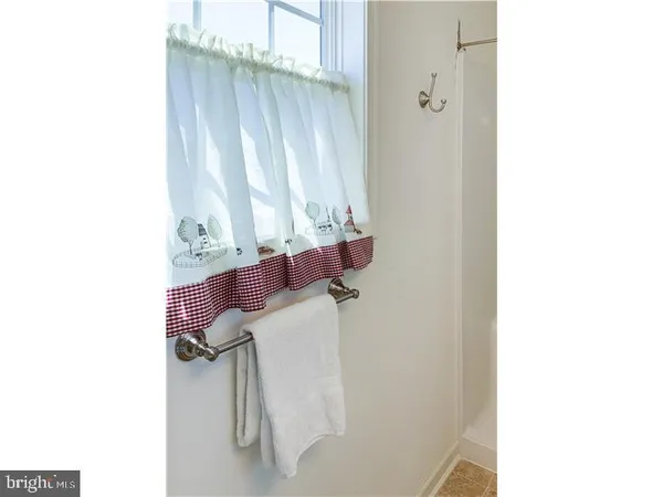 a picture of a bathroom with a window