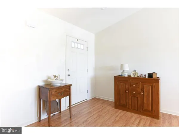 a workspace room with wooden floor