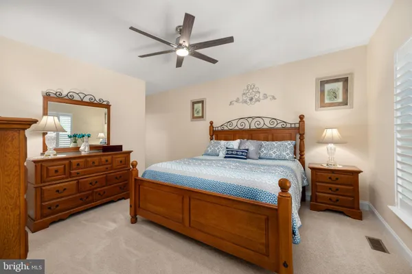 a bedroom with a bed and a dresser