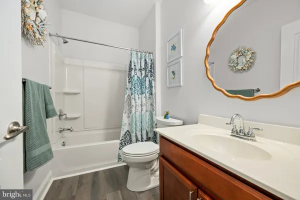 a bathroom with a sink a toilet and a bathtub