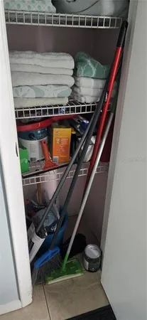 a front view of a building with a garden