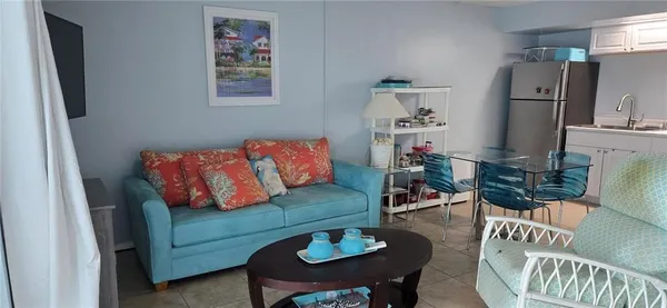 a living room with furniture and a table