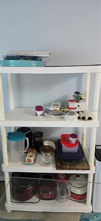 a utility room with stainless steel appliances and cabinets