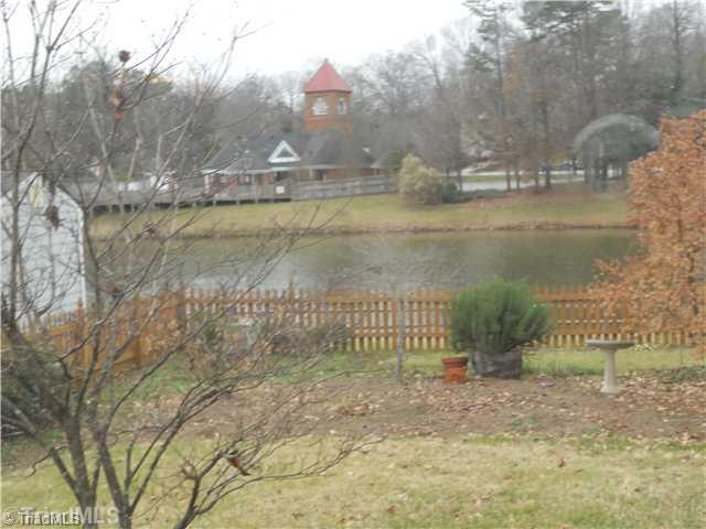2602 Castle Croft Road Greensboro, NC 27407 - Photo 14 of 16 Landscaping. Beautiful view from the breakfast room window...over looking fenced yard and pond.