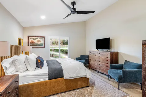 a bedroom with bed and a window