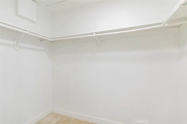 a view of a room with shelf on the wall