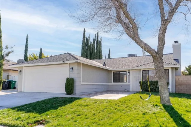 a view of house with yard