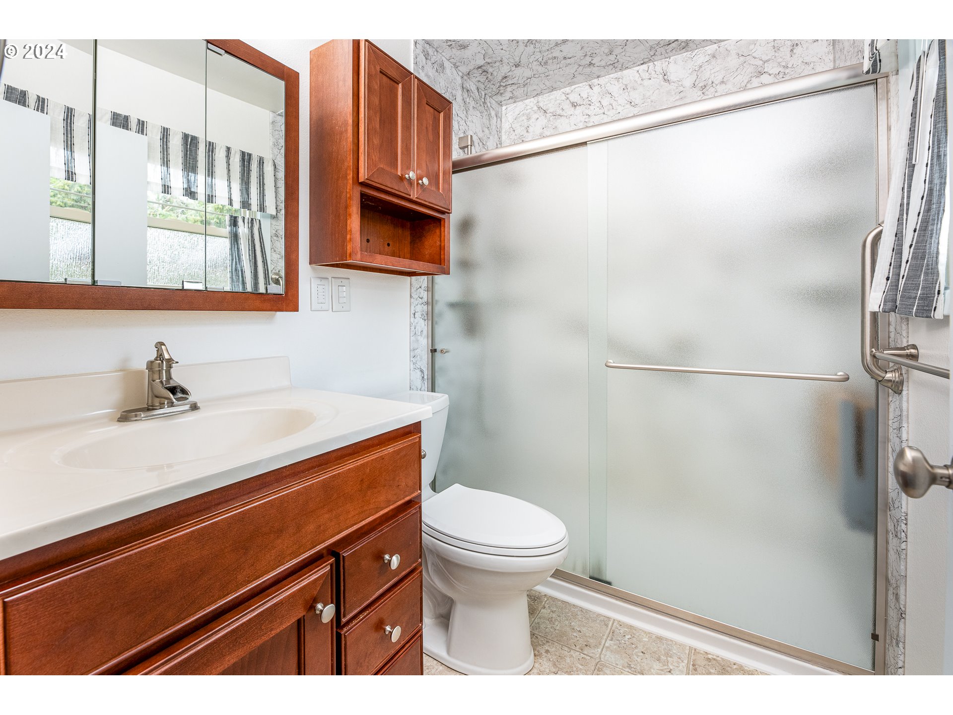 1039 Nancy Avenue Springfield, OR 97477 - Photo 18 of 40 a bathroom with a sink toilet vanity and shower