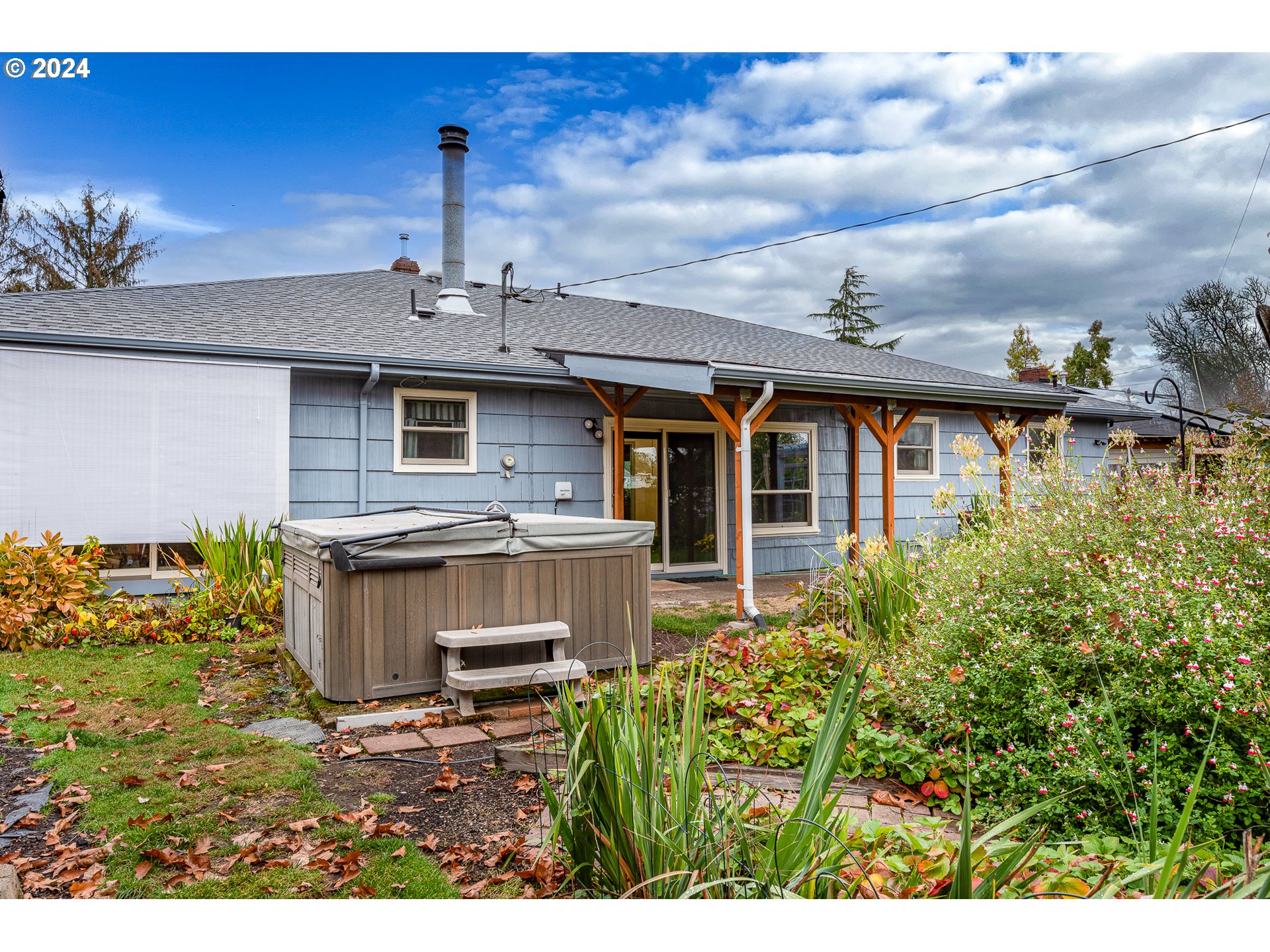 1039 Nancy Avenue Springfield, OR 97477 - Photo 31 of 40 a view of a house with a small yard and potted plants