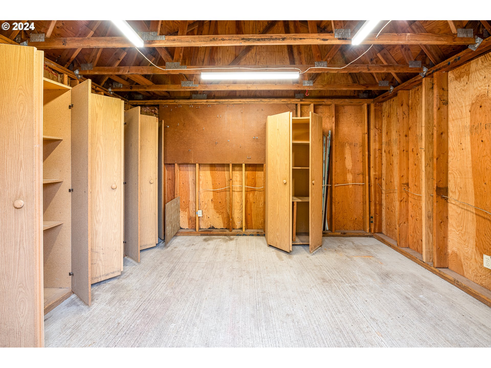 1039 Nancy Avenue Springfield, OR 97477 - Photo 39 of 40 a view of a room with wooden walls and a window