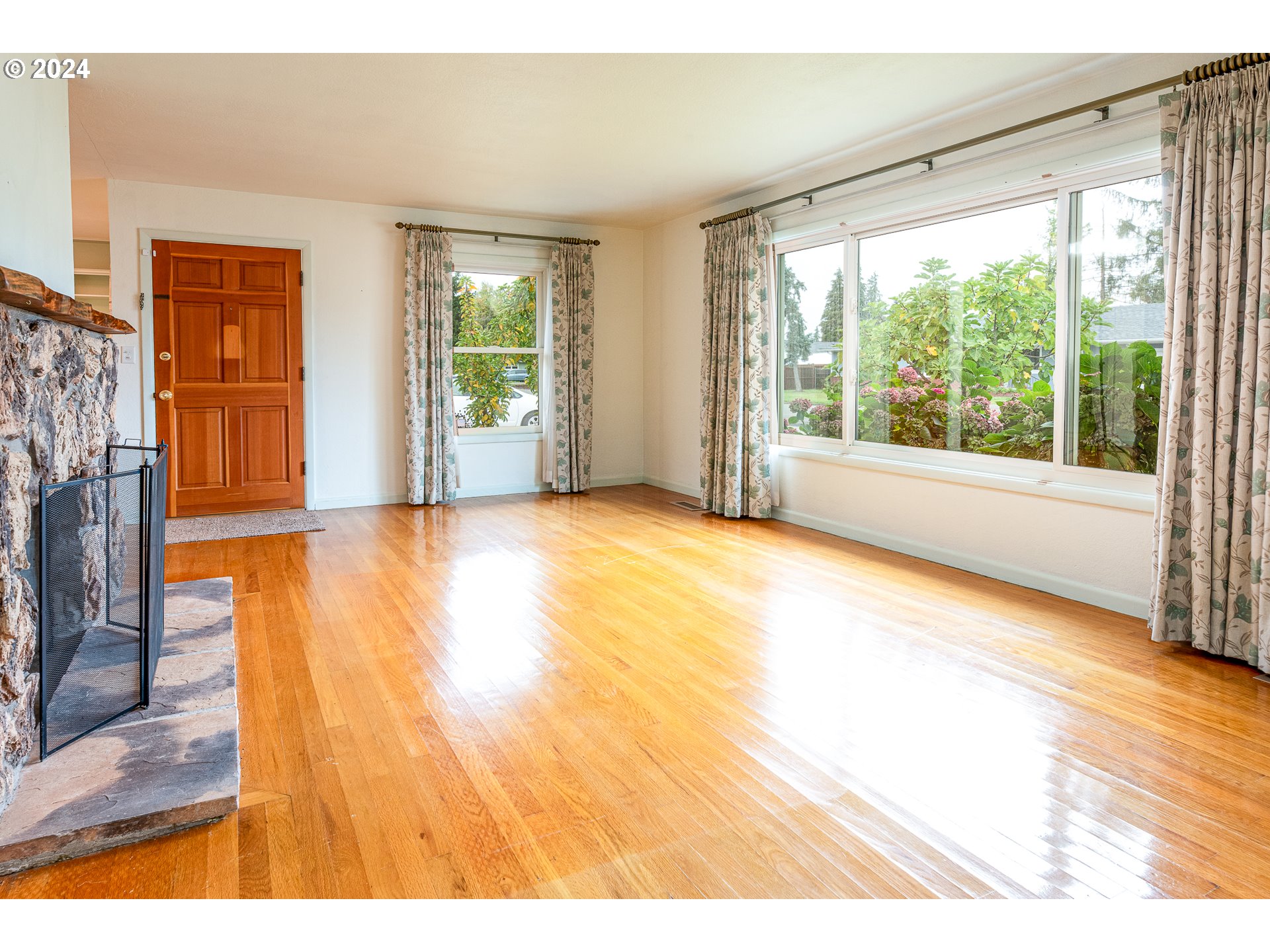 1039 Nancy Avenue Springfield, OR 97477 - Photo 8 of 40 a view of empty room with wooden floor and fan