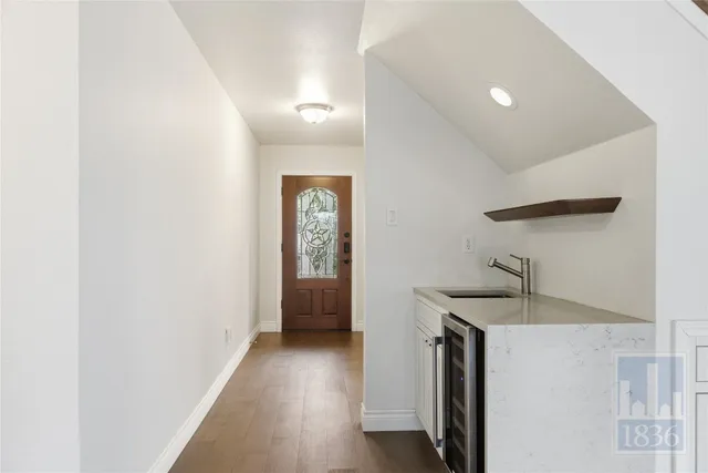 a view of staircase with white walls and a window