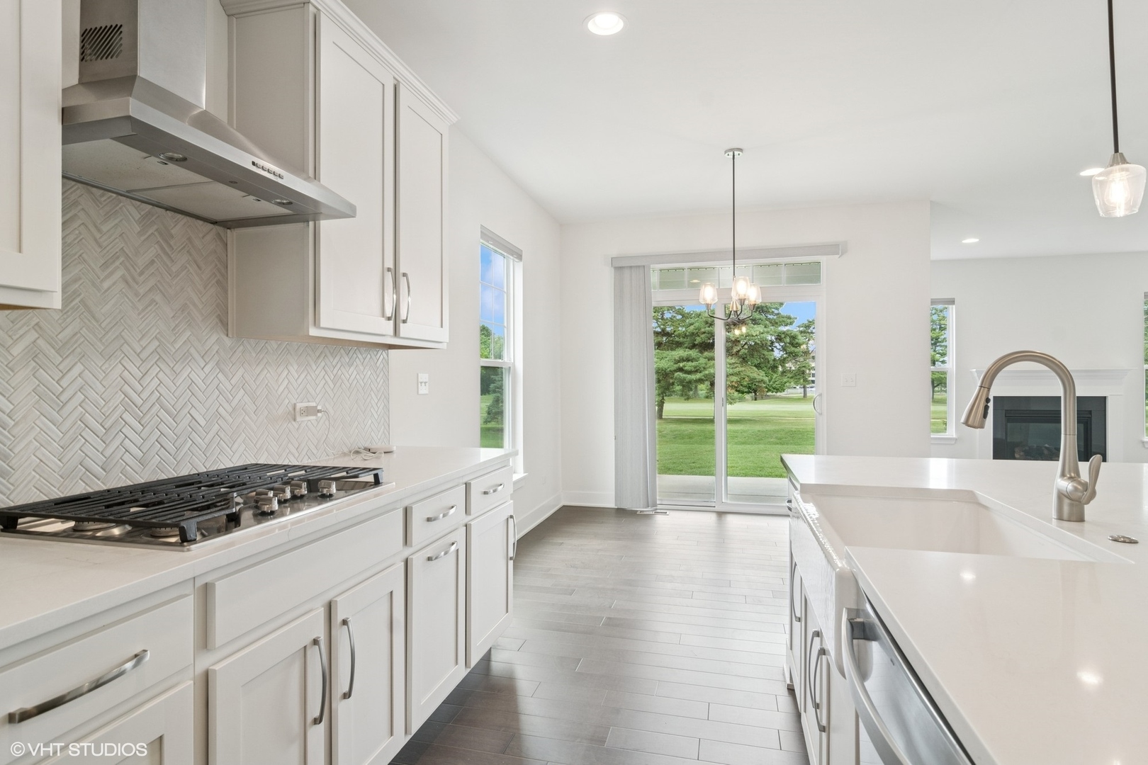 23068 Pinehurst Drive Kildeer, IL 60047 - Photo 12 of 30 a kitchen with kitchen island a sink appliances cabinets and a large window
