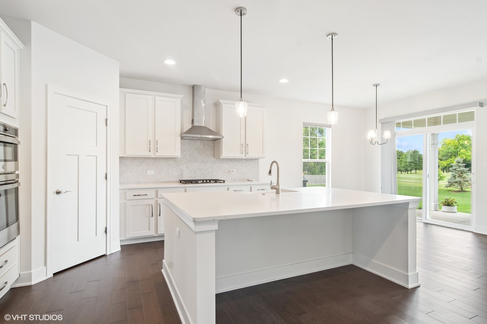 23068 Pinehurst Drive Kildeer, IL 60047 - Photo 13 of 30 a kitchen with stainless steel appliances sink a refrigerator and white cabinets
