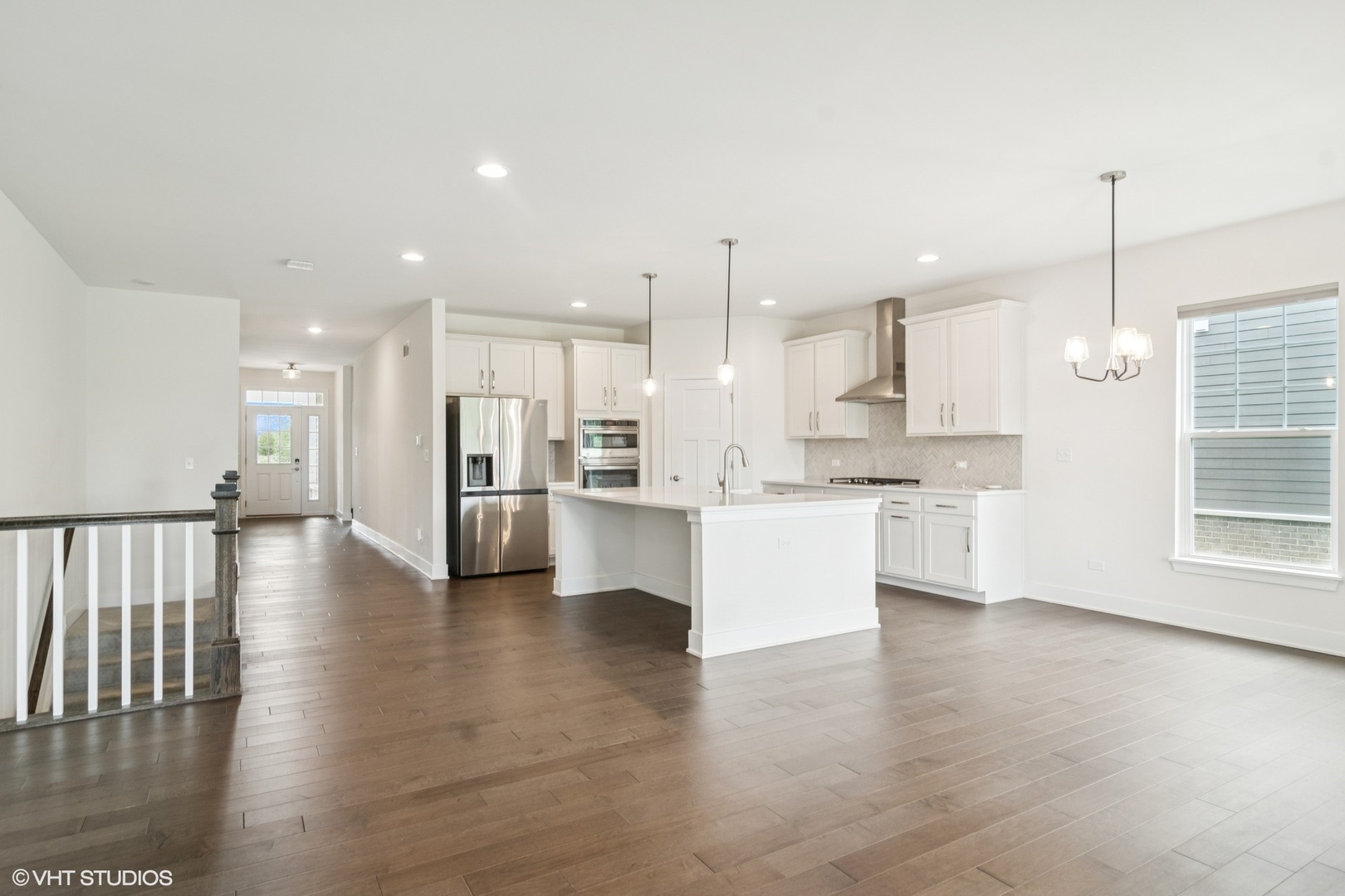 23068 Pinehurst Drive Kildeer, IL 60047 - Photo 15 of 30 a view of kitchen with kitchen island white cabinets wooden floor and center island