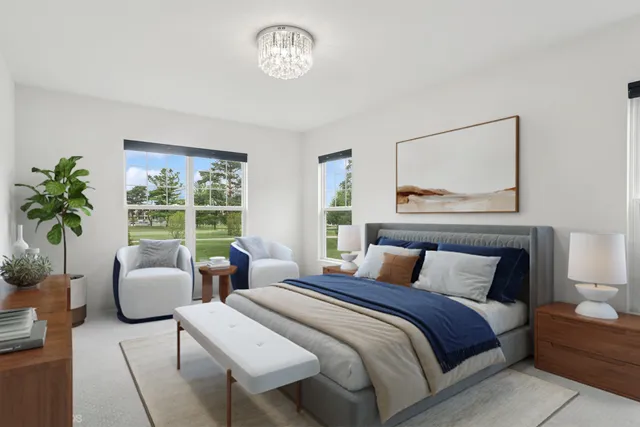 a bedroom with a large bed and a couch