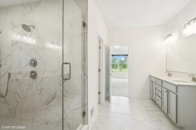 a bathroom with a mirror and a shower