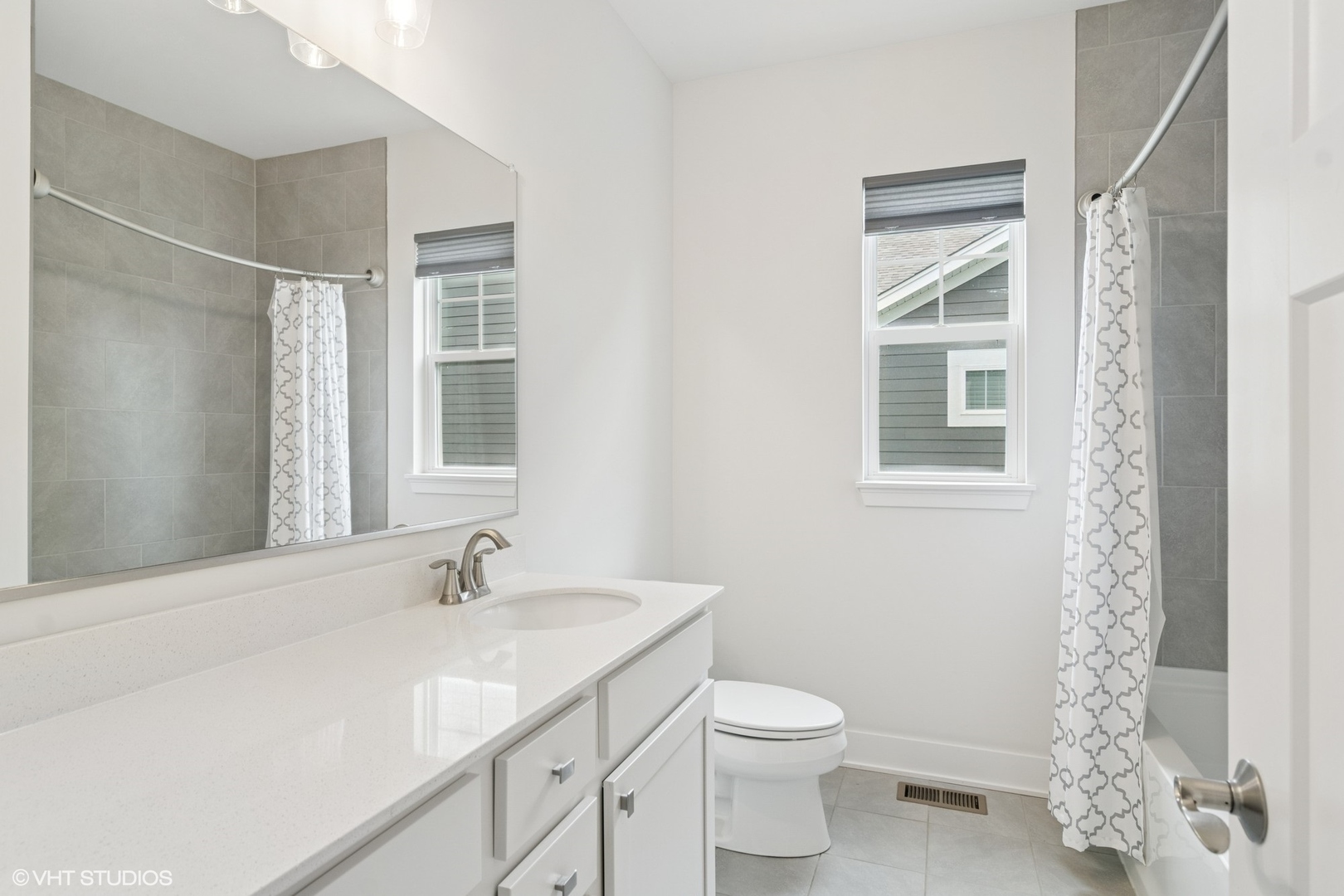 23068 Pinehurst Drive Kildeer, IL 60047 - Photo 24 of 30 a bathroom with a granite countertop sink a toilet and a shower