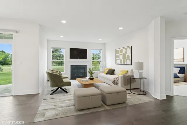 a living room with furniture a fireplace and a flat screen tv