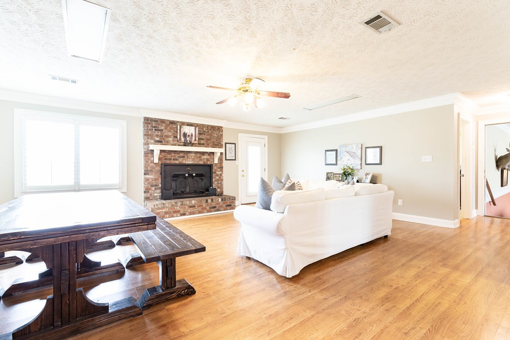 336 Clark Road Seale, AL 36875 - Photo 12 of 66 a living room with fireplace furniture and a flat screen tv